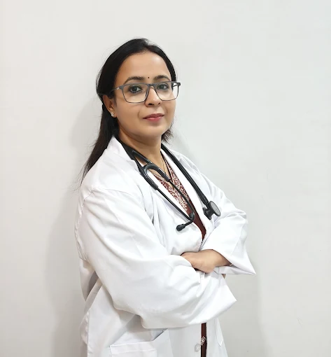 Dr. Anjali Verma, MD – General Medicine, wearing a white coat and stethoscope, standing confidently at B Healthy Clinic in Nipania, Indore.